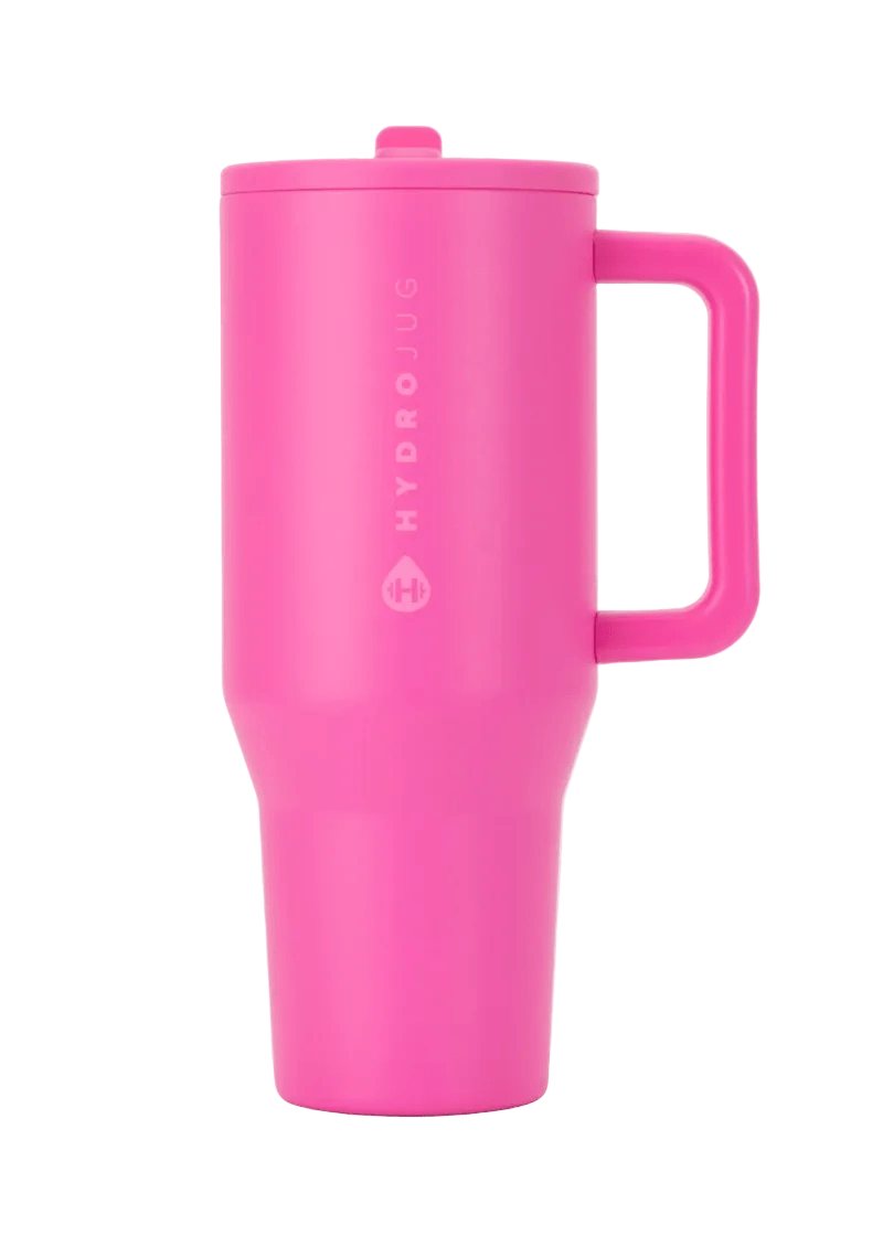 A bright pink HydroJug travel tumbler with a matching lid and integrated handle, shown on a light gray background.