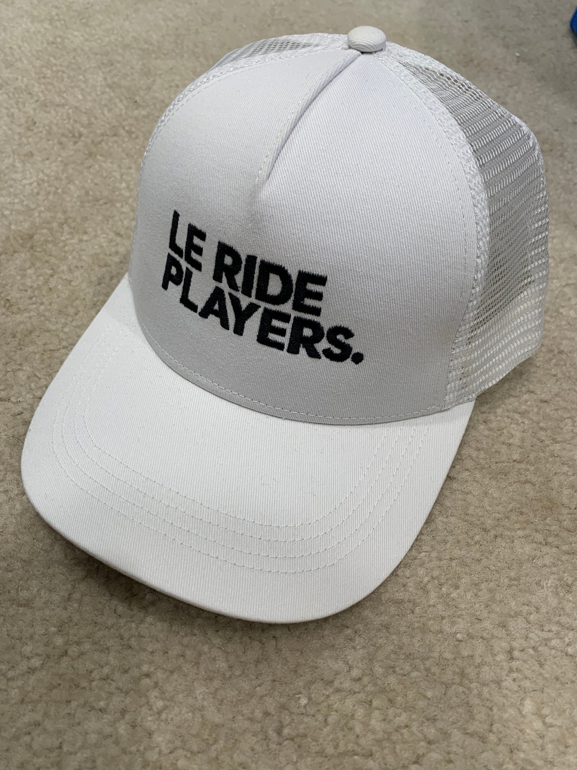 Equestrian Team Apparel Hats Le Ride. Trucker Cap Mesh Back White Le Ride Players equestrian team apparel online tack store mobile tack store custom farm apparel custom show stable clothing equestrian lifestyle horse show clothing riding clothes horses equestrian tack store